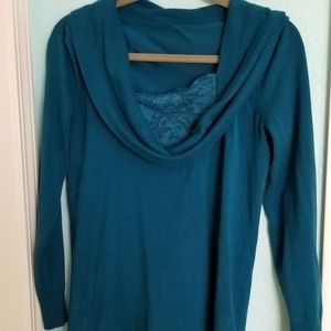 Elongating, blue green sweater, scooped neckline.